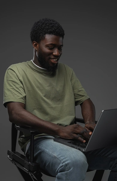 A marketer working on a campaign on their laptop